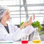 scientist working in organic agriculture farm research new chemical formula extract from plant