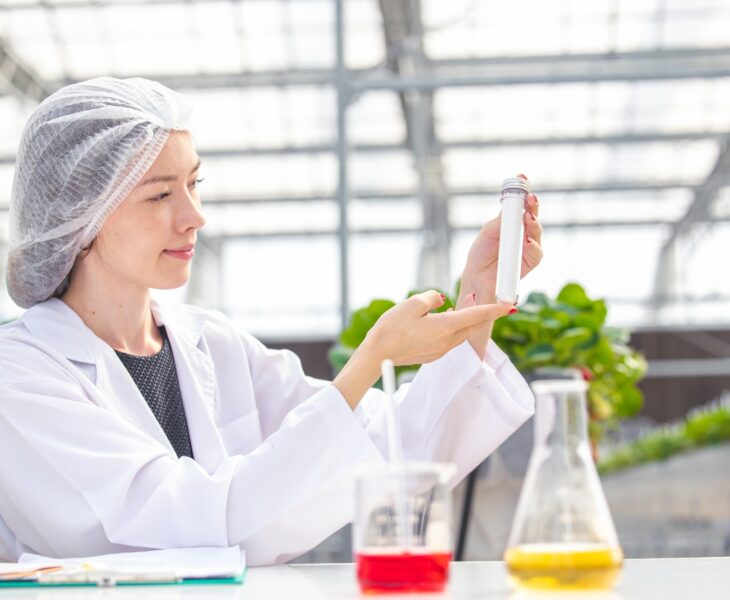 scientist working in organic agriculture farm research new chemical formula extract from plant