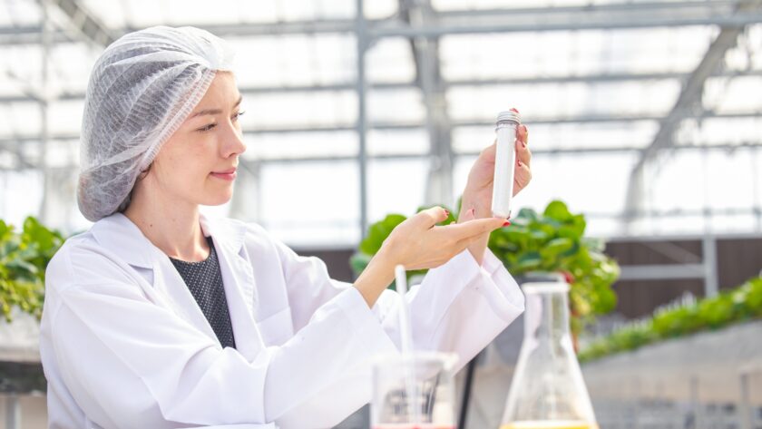 scientist working in organic agriculture farm research new chemical formula extract from plant
